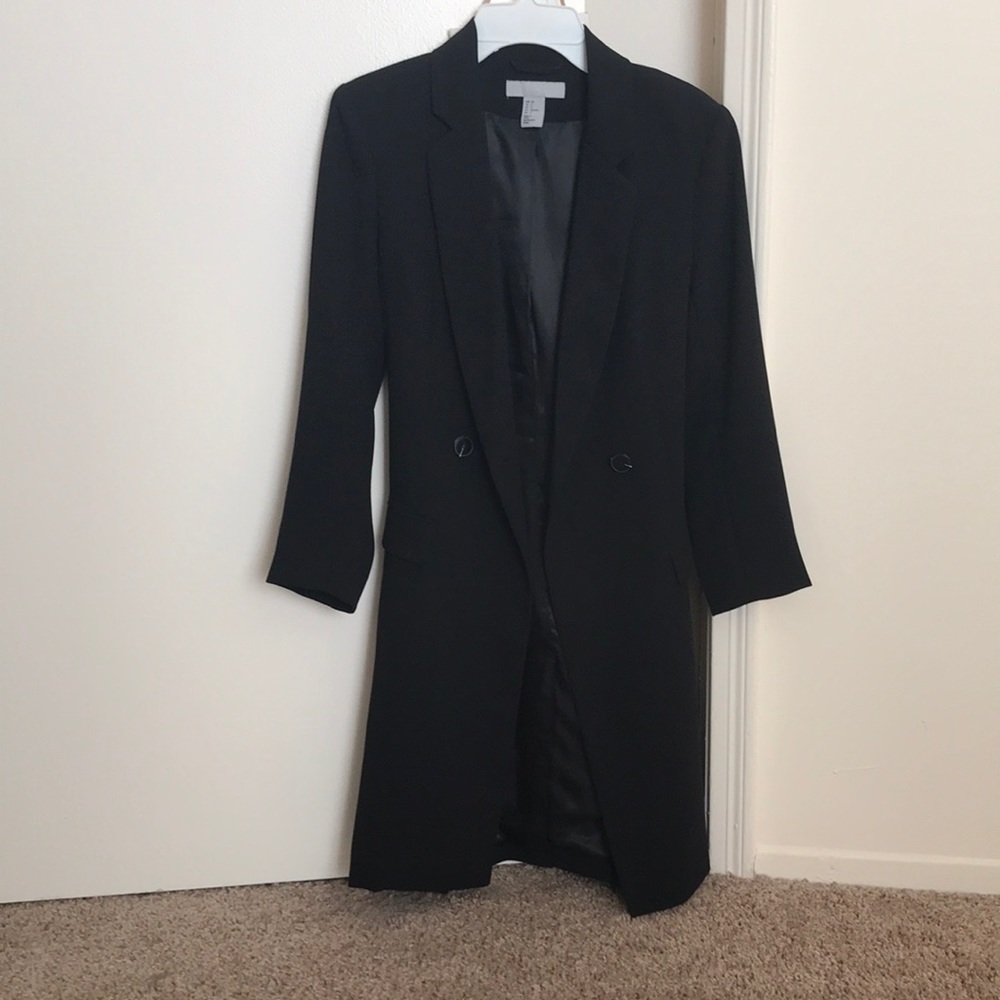 Knee-length black coat by H&M.